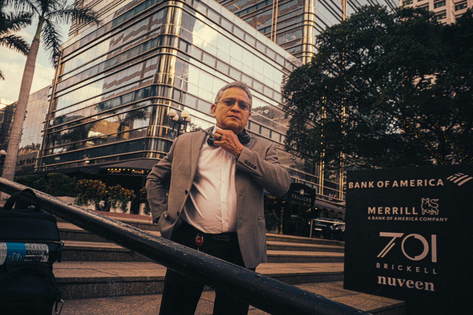 Confident small business owner standing outside a corporate office in the USA, representing the importance of business insurance for small business success.